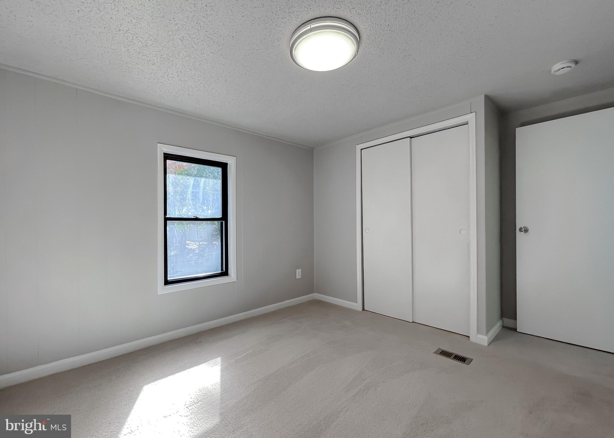 22489 Wainwright Court California, MD 20619 - Photo 17 of 41 an empty room with windows and closet