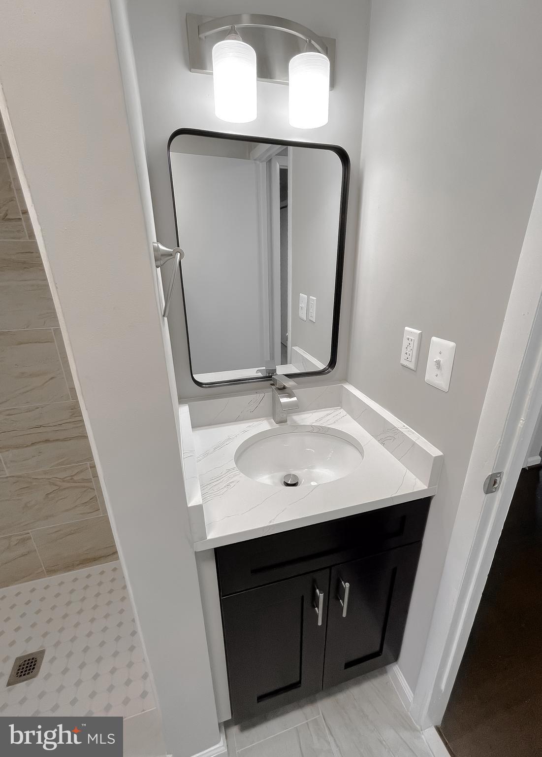 22489 Wainwright Court California, MD 20619 - Photo 21 of 41 a bathroom with a sink a mirror and vanity