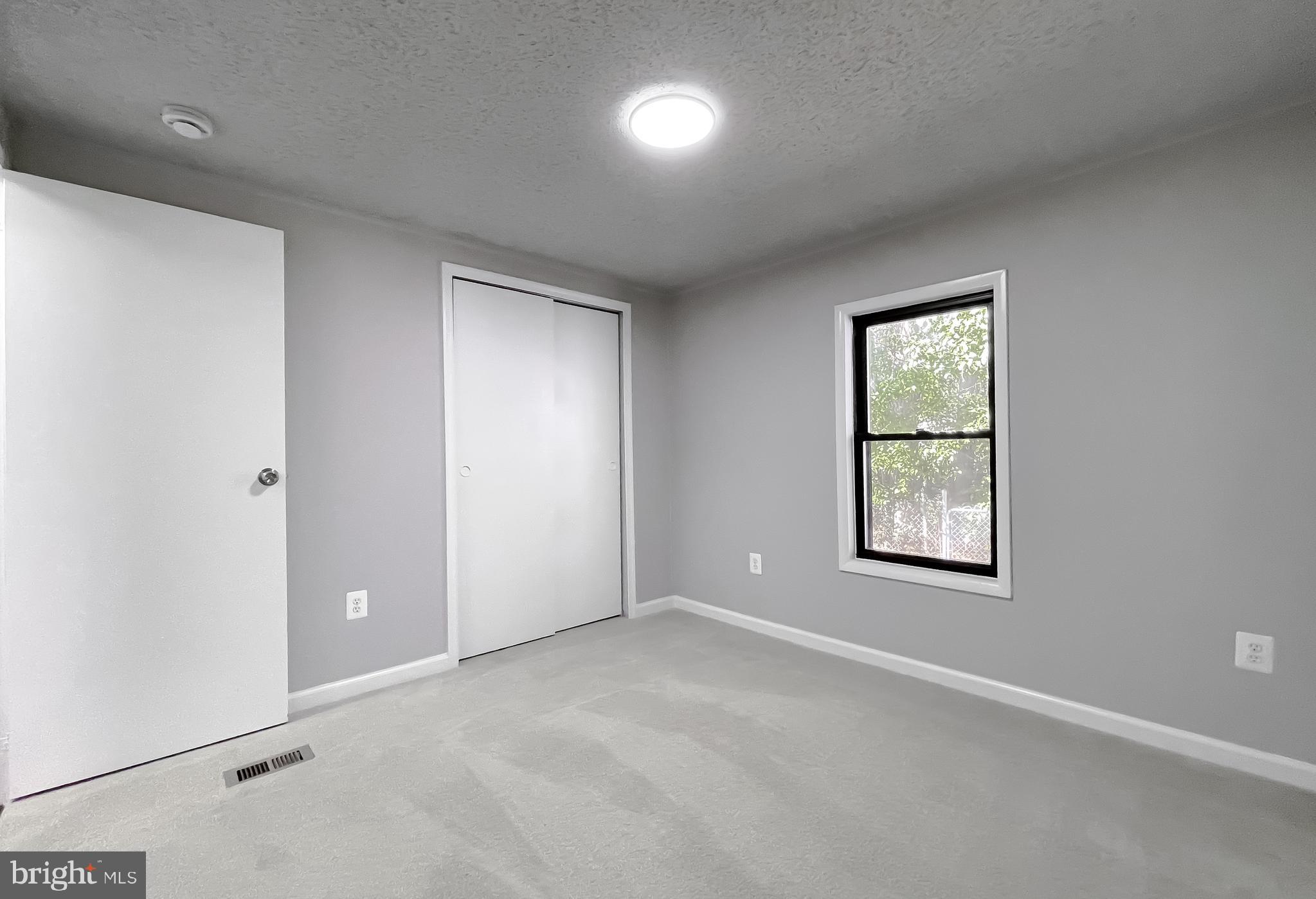 22489 Wainwright Court California, MD 20619 - Photo 23 of 41 an empty room with windows and closet