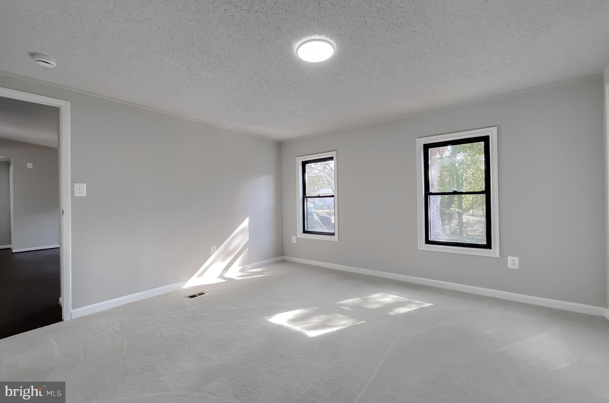 22489 Wainwright Court California, MD 20619 - Photo 27 of 41 a view of empty room with windows