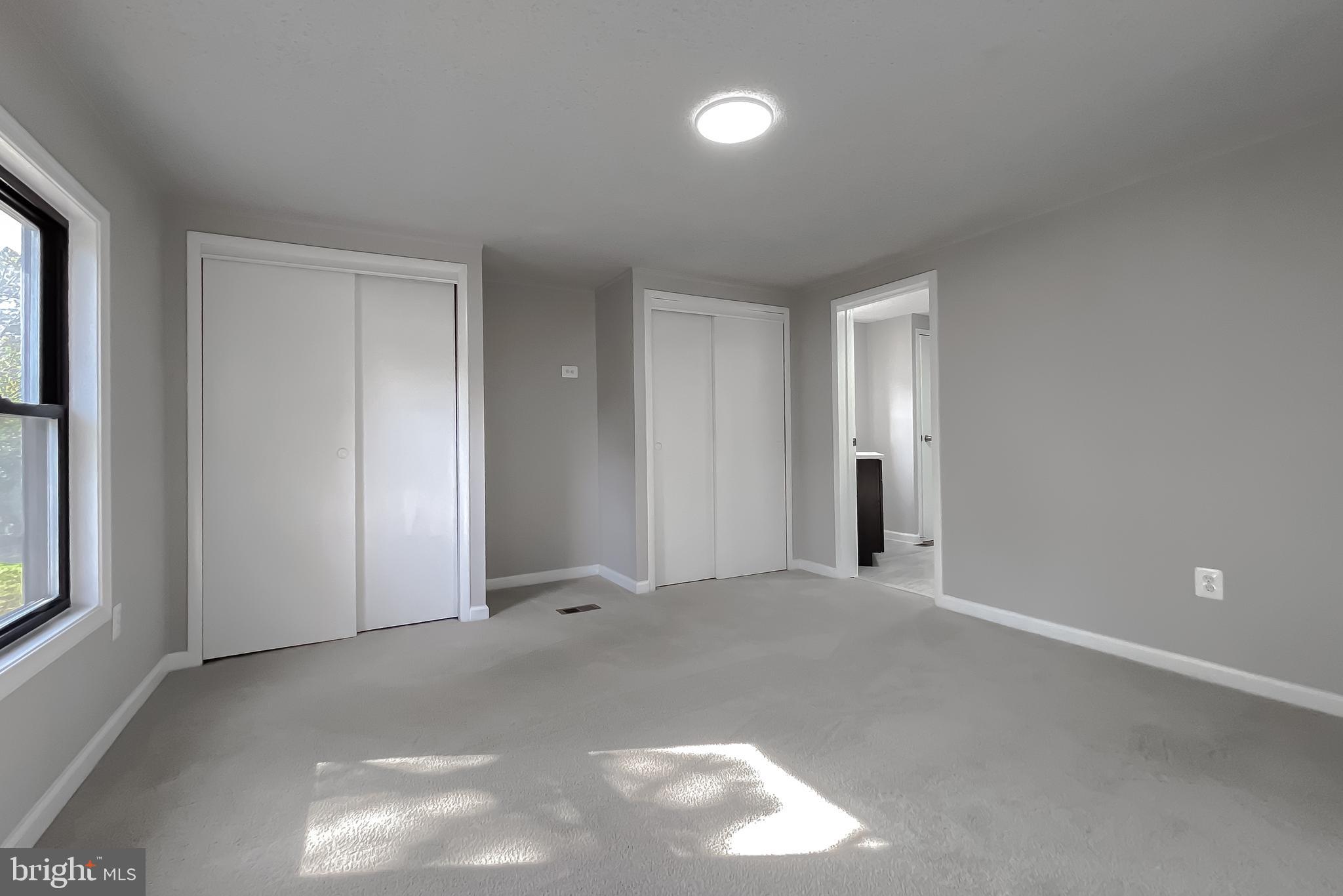 22489 Wainwright Court California, MD 20619 - Photo 28 of 41 a view of an empty room with windows and closet