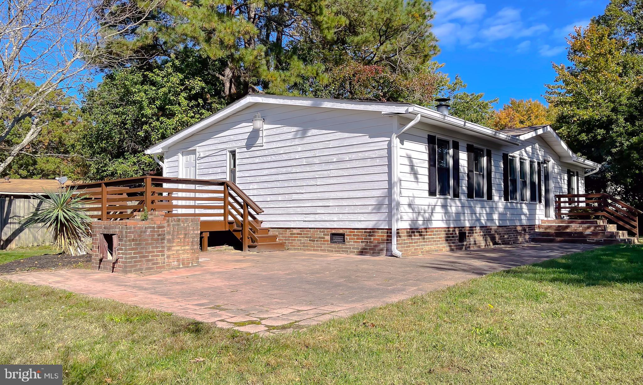 22489 Wainwright Court California, MD 20619 - Photo 3 of 41 a view of a house with backyard and sitting area