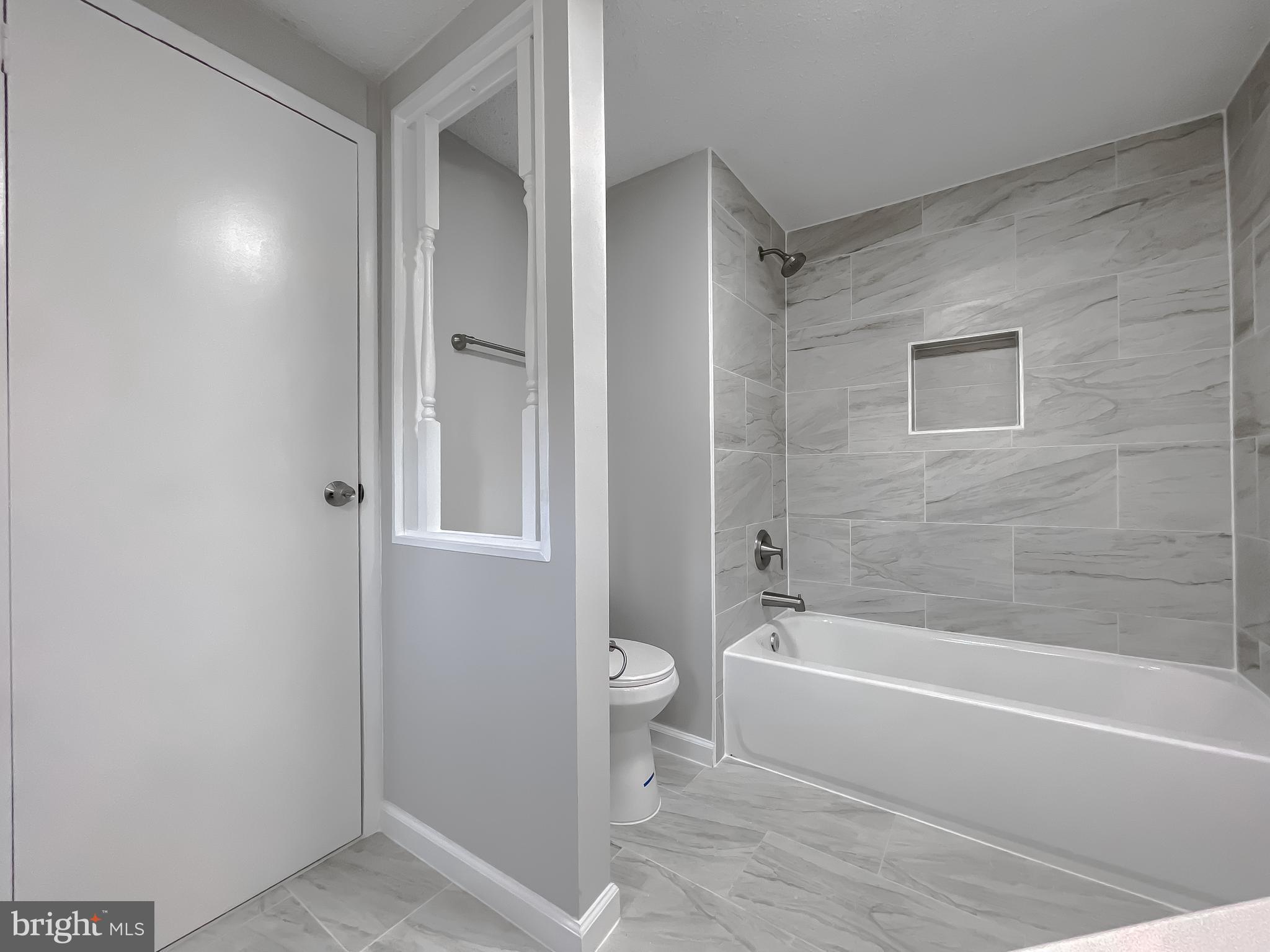 22489 Wainwright Court California, MD 20619 - Photo 31 of 41 a white bath tub sitting next to a toilet