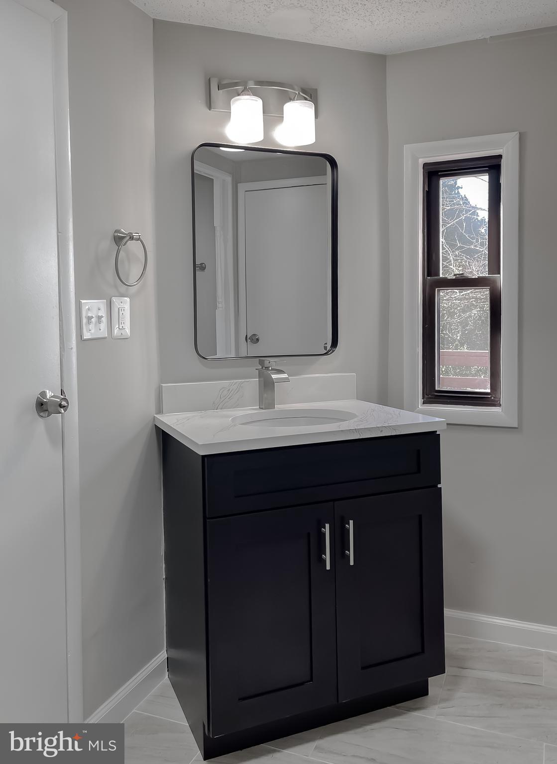 22489 Wainwright Court California, MD 20619 - Photo 33 of 41 a bathroom with a sink vanity and a mirror