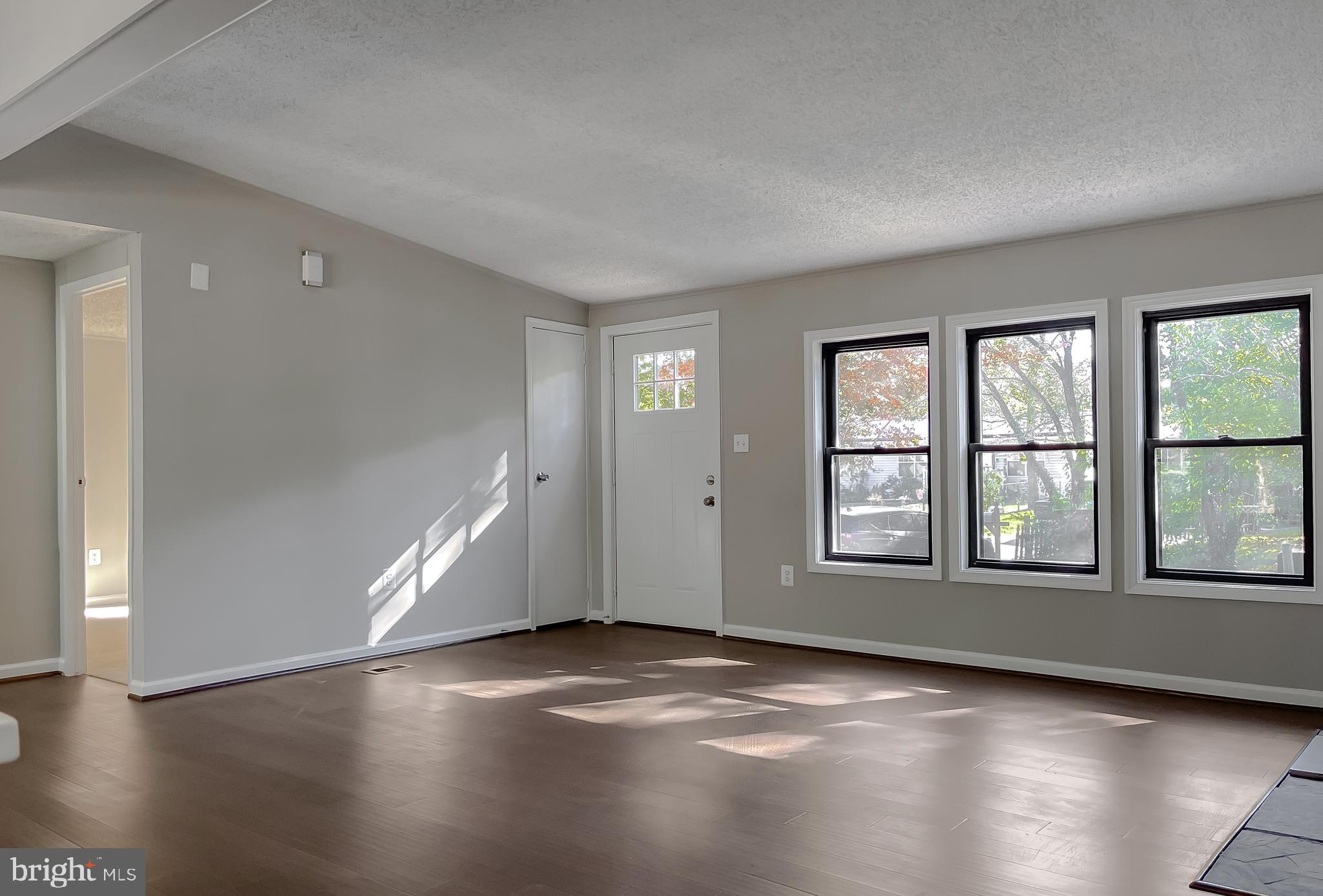 22489 Wainwright Court California, MD 20619 - Photo 8 of 41 an empty room with wooden floor and windows