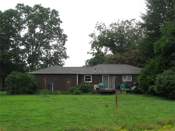242 Florence Road Northampton, MA 01062 - Photo 3 of 16 a front view of a house with a garden