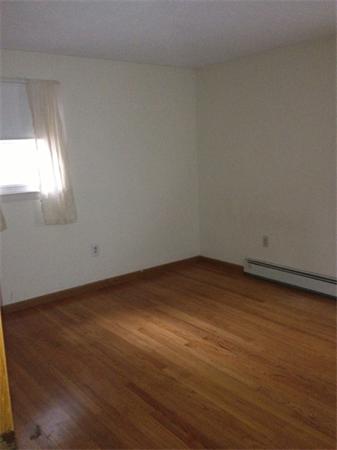 242 Florence Road Northampton, MA 01062 - Photo 8 of 16 a view of empty room with wooden floor and fan