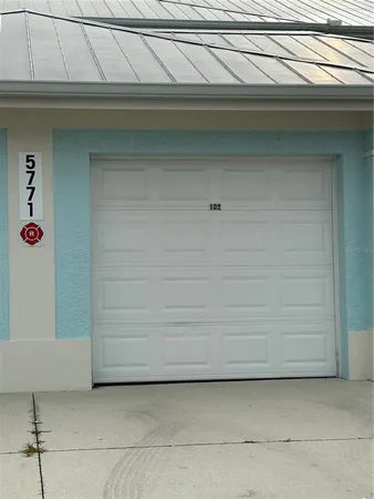 a view of a fountain in front of a big yard