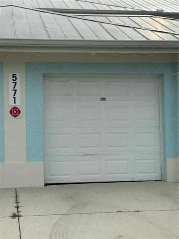 a view of a fountain in front of a big yard