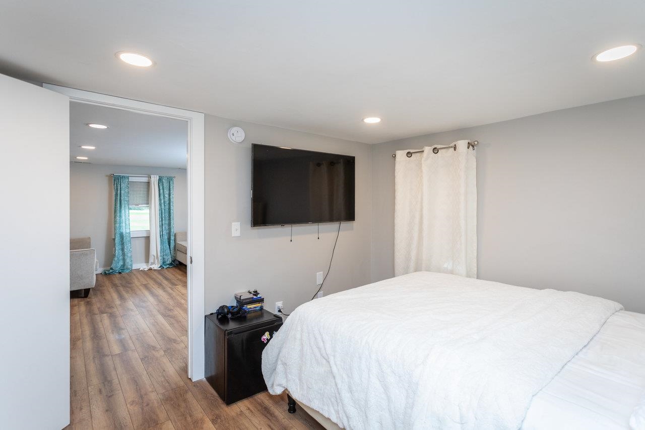 7452 Briery Branch Road Dayton, VA 22821 - Photo 24 of 66 a bedroom with a bed and a flat screen tv