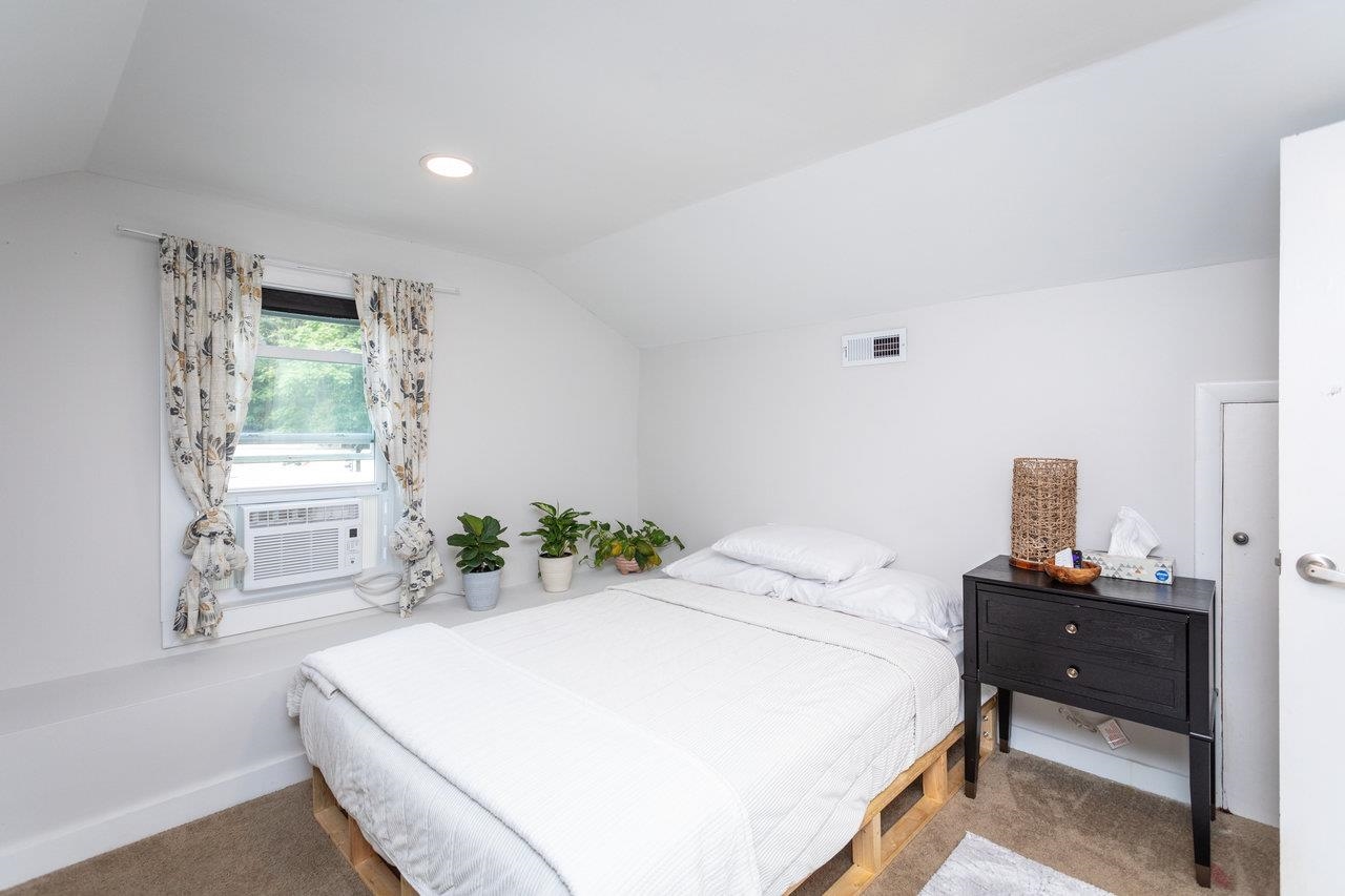 7452 Briery Branch Road Dayton, VA 22821 - Photo 36 of 66 a bedroom with a bed and a window