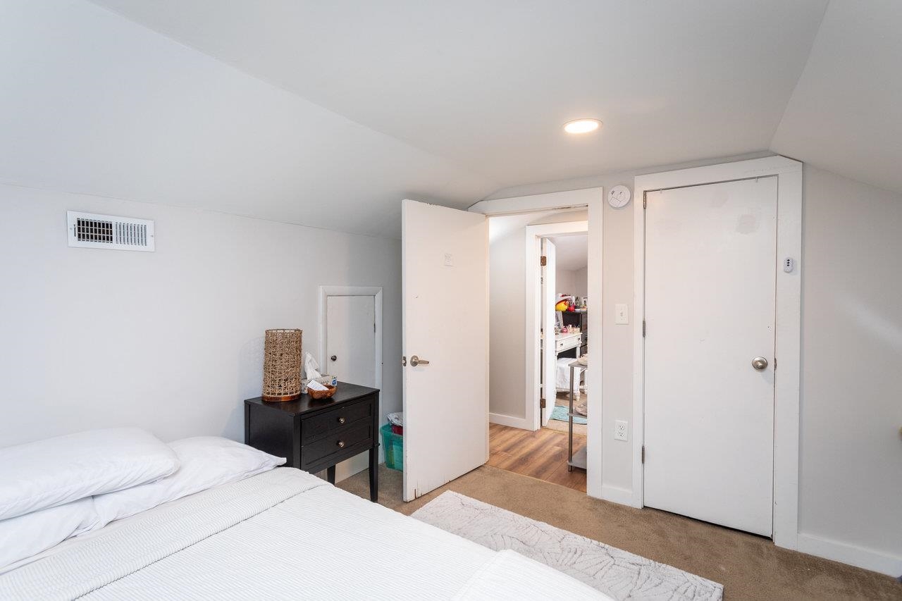 7452 Briery Branch Road Dayton, VA 22821 - Photo 37 of 66 a bedroom with a bed and wooden floor