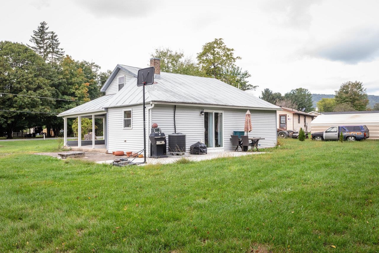 7452 Briery Branch Road Dayton, VA 22821 - Photo 62 of 66 a front view of a house with a garden and porch