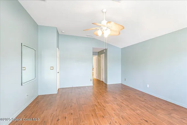 a bathroom with a tub shower and window