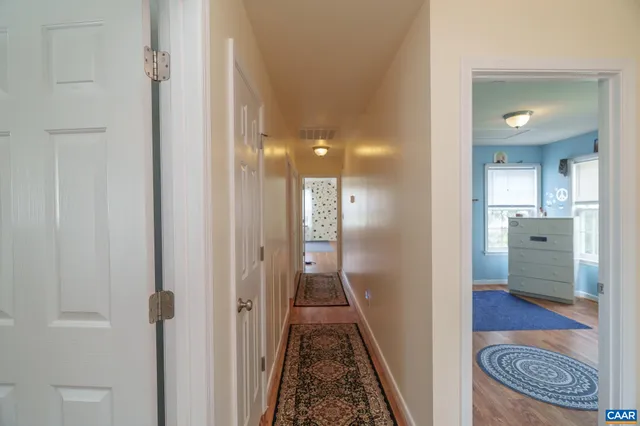 a en suite bathroom with a double vanity sink and a mirror