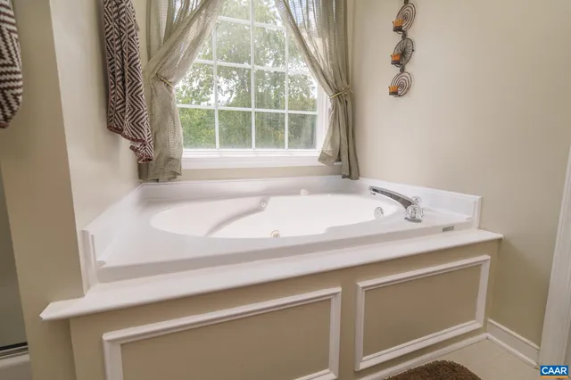 a view of a livingroom with workspace and a window
