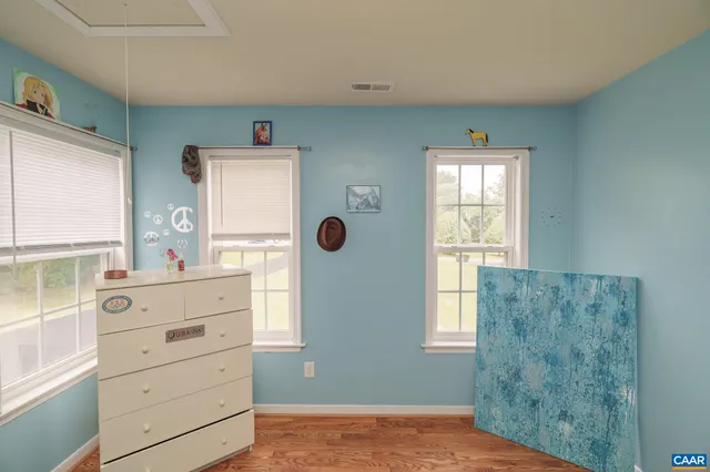 a bathroom with a sink a light fixture and a mirror