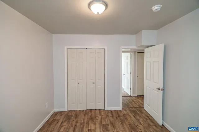a view of a house with a yard and garage