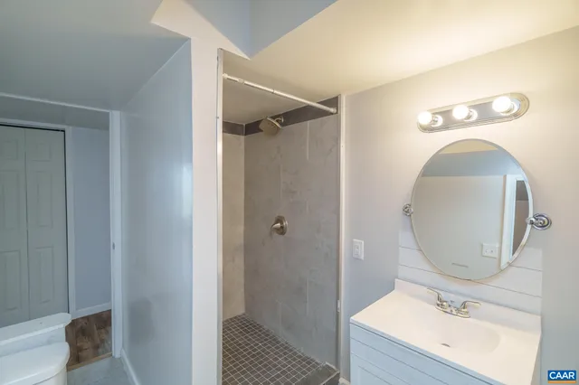 an aerial view of a house with swimming pool outdoor seating and yard