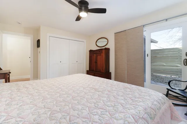 a bedroom with a bed and a dresser