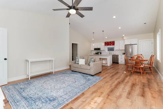 a living room with furniture and a rug