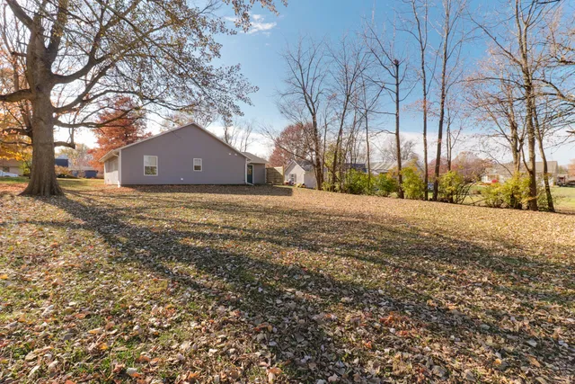 a view of large house with a yard