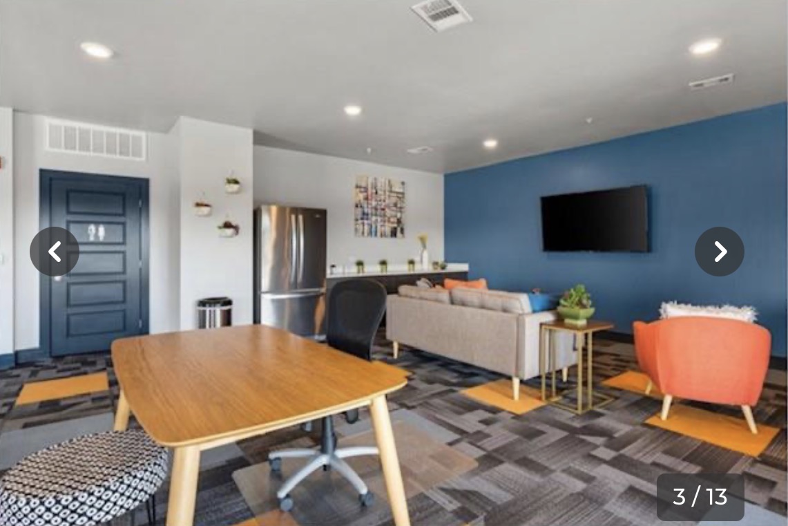 6444 Burnet Road, Unit 201 Austin, TX 78757 - Photo 18 of 18 A vibrant communal space offers stainless steel appliances, inviting seating, and functional workspace.