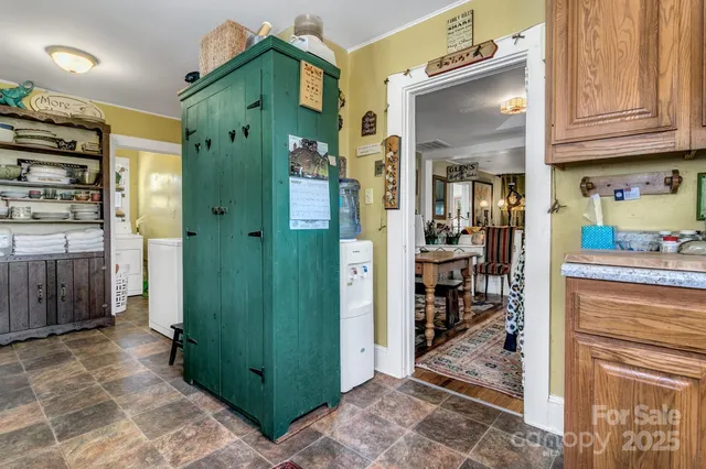 a kitchen with stainless steel appliances granite countertop a stove and a refrigerator