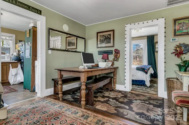 a living room with furniture and a bookshelf