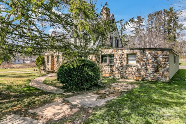 a bed room with furniture and a flat screen tv