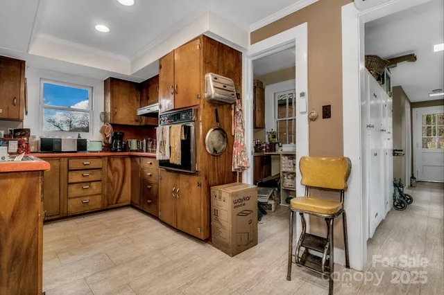 a view of a house with a yard and sitting area
