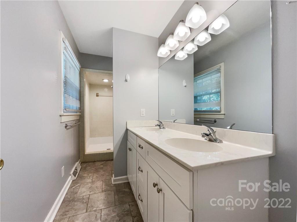 540 Neel Road Salisbury, NC 28147 - Photo 13 of 22 a bathroom with a sink vanity and a mirror