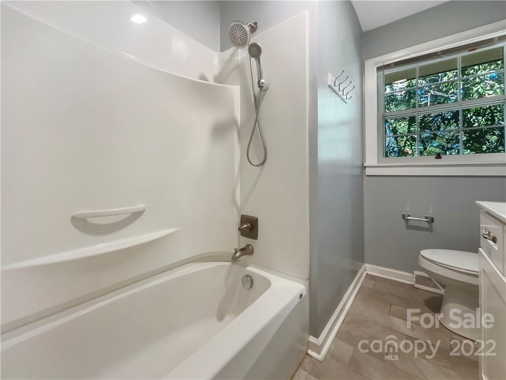 540 Neel Road Salisbury, NC 28147 - Photo 17 of 22 a bathroom with a bath tub and a shower