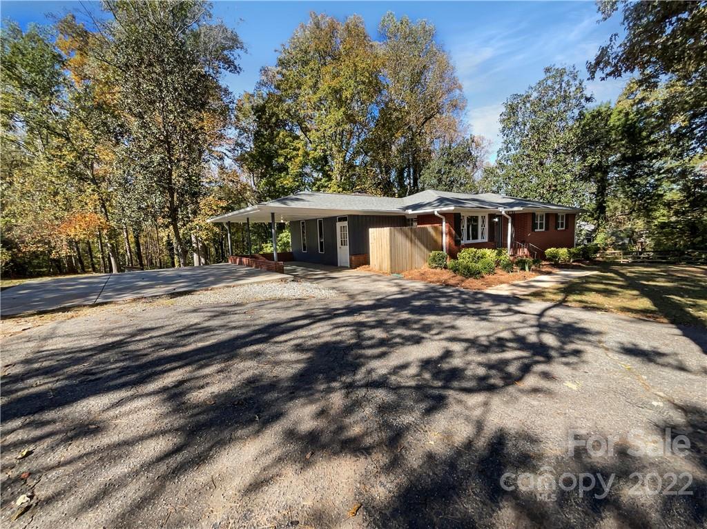 540 Neel Road Salisbury, NC 28147 - Photo 2 of 22 a backyard of a house with yard and outdoor seating
