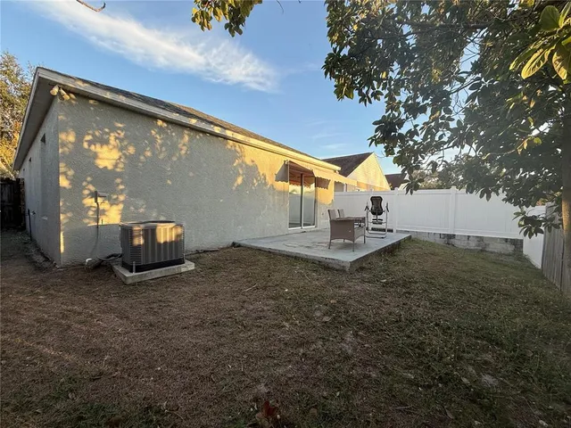 a view of a back yard of the house
