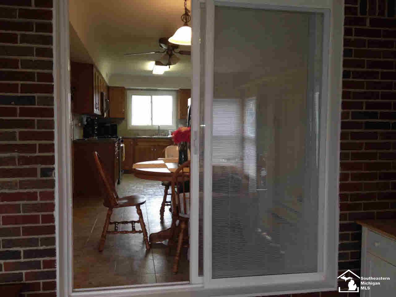 3668 Consear Road Lambertville, MI 48144 - Photo 6 of 17 Patio to sunroom
