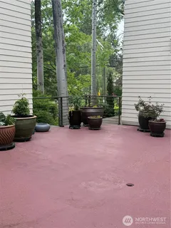 a view of a backyard with sitting area