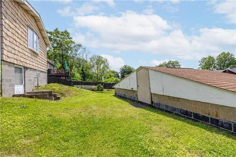 a view of a backyard with sitting area