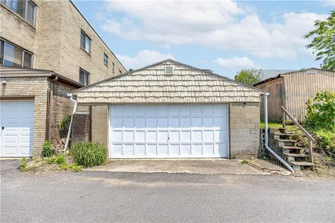 a front view of a house with a garage