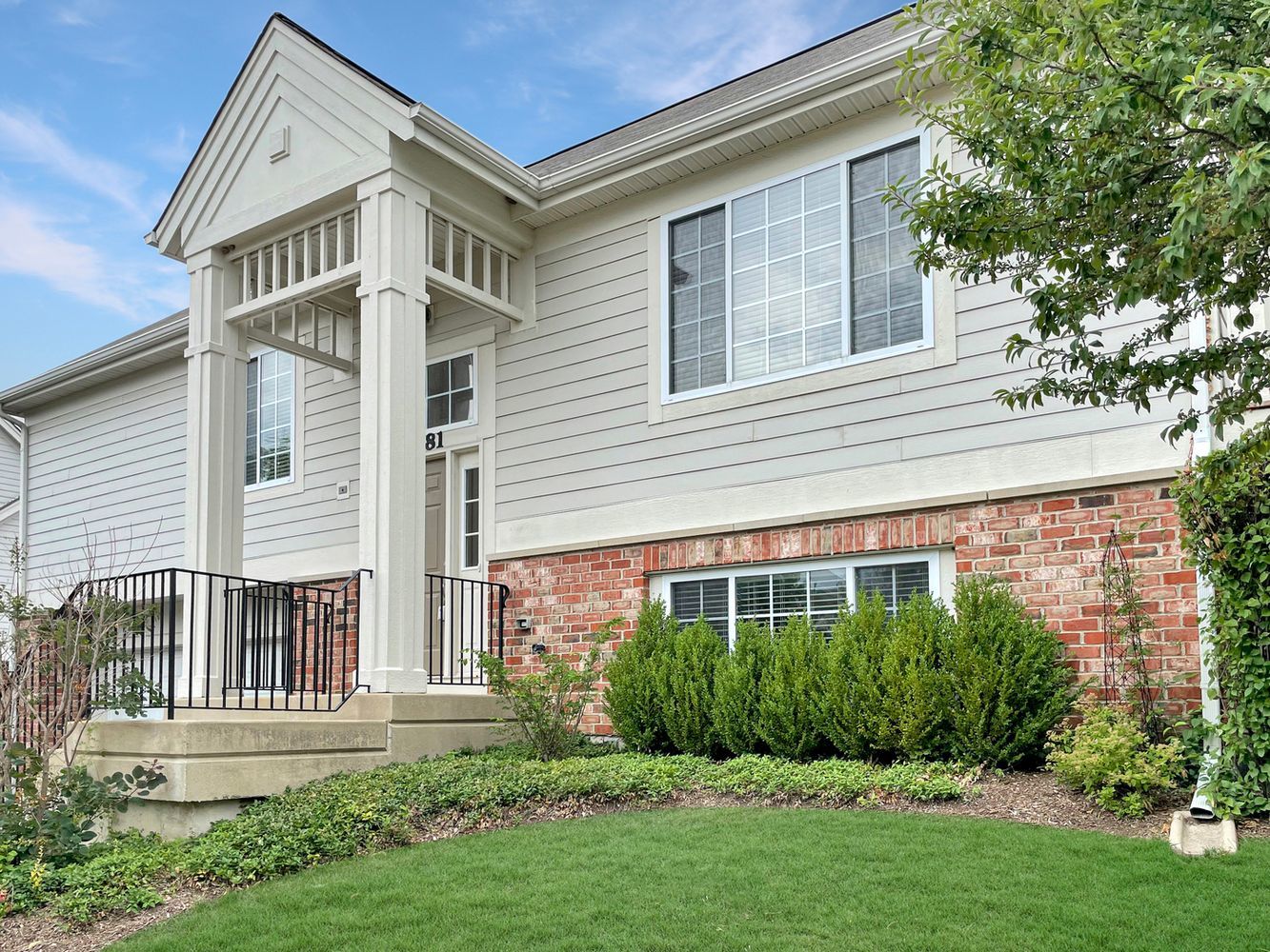 front view of a house with a yard