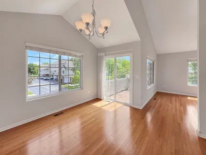 a view of a livingroom with a window and a ceiling fan