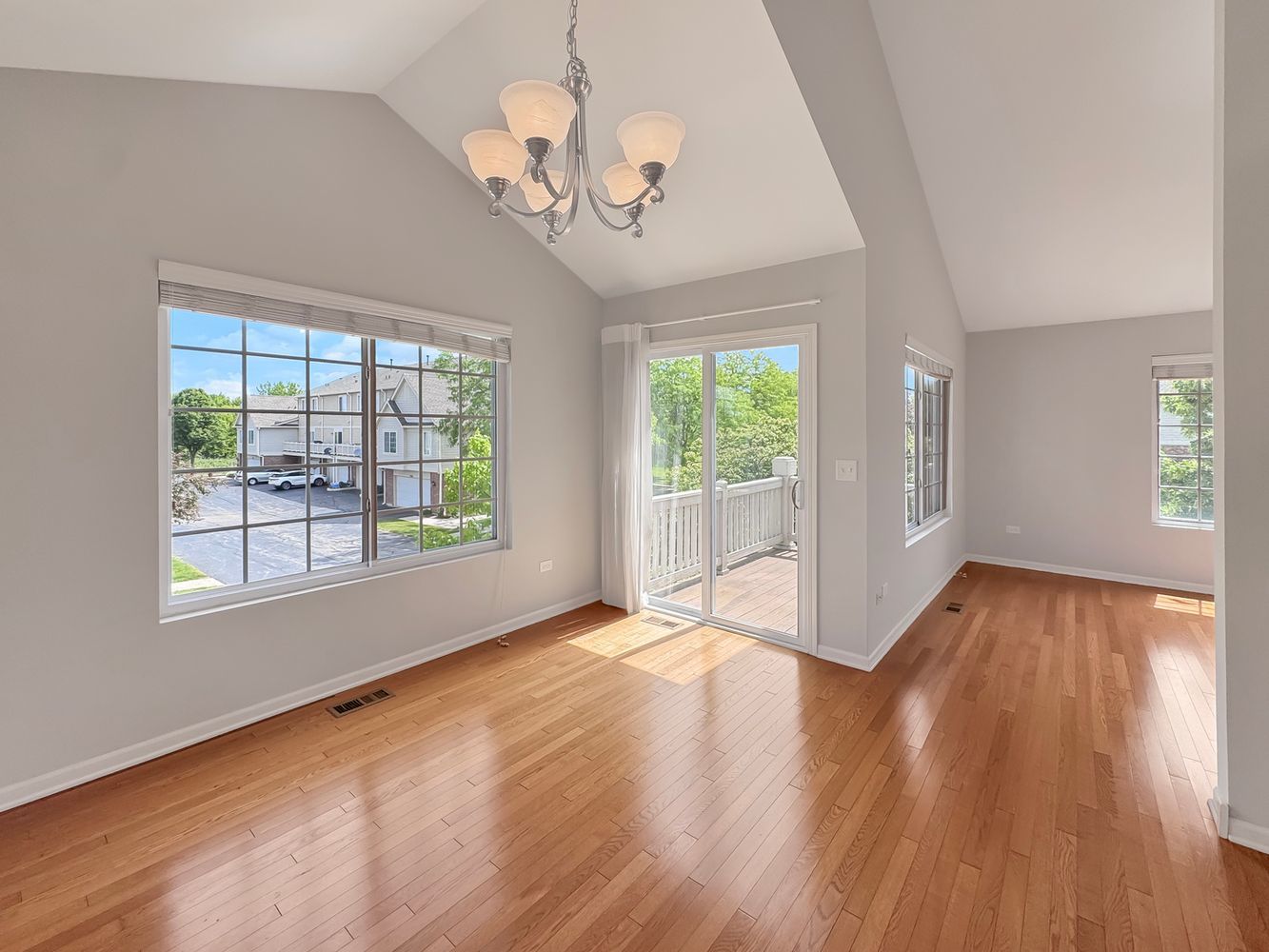 3381 Cameron Drive Elgin, IL 60124 - Photo 12 of 23 a view of an empty room with wooden floor and a window
