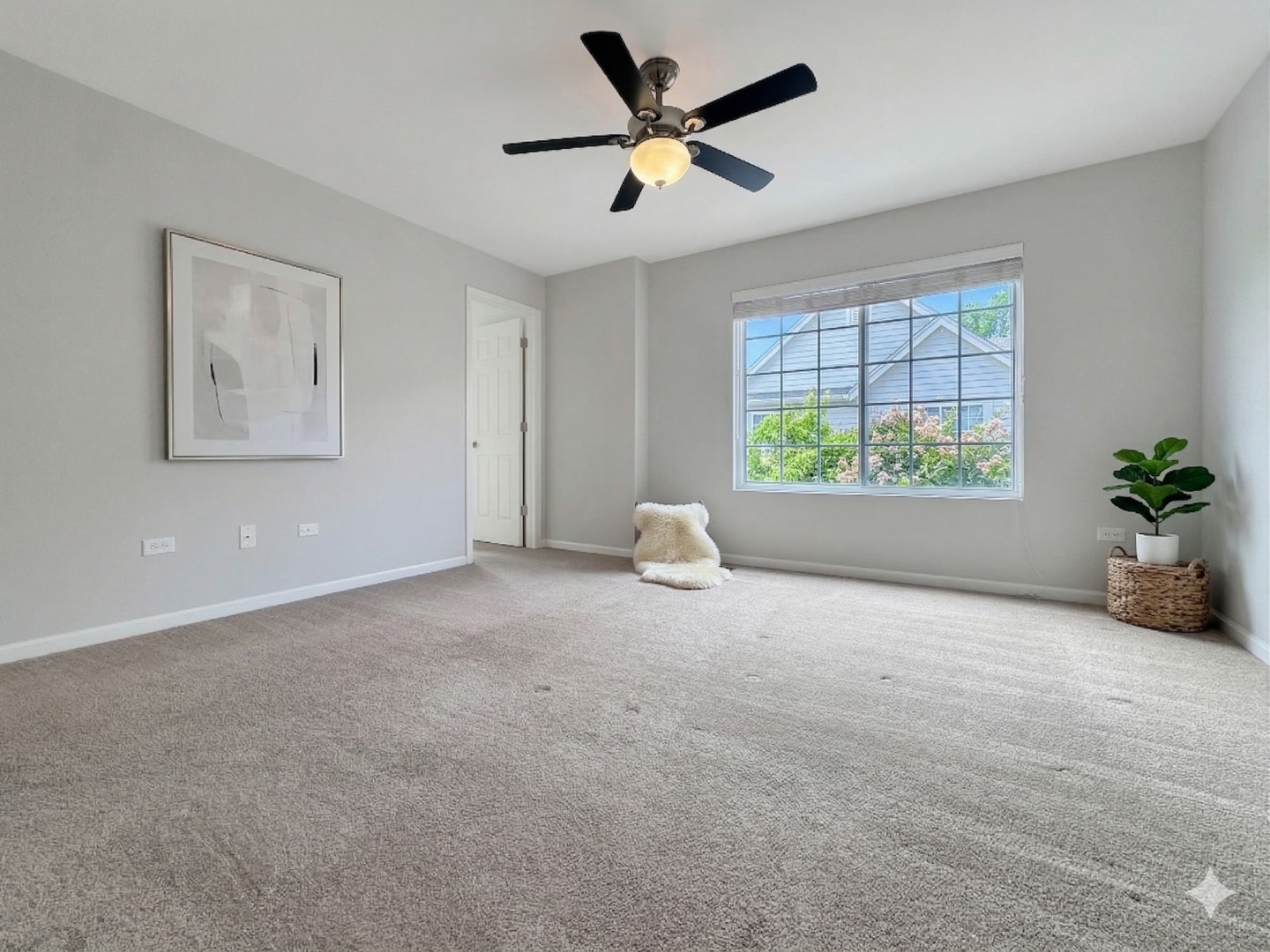 3381 Cameron Drive Elgin, IL 60124 - Photo 13 of 23 a view of a livingroom with a window and a ceiling fan