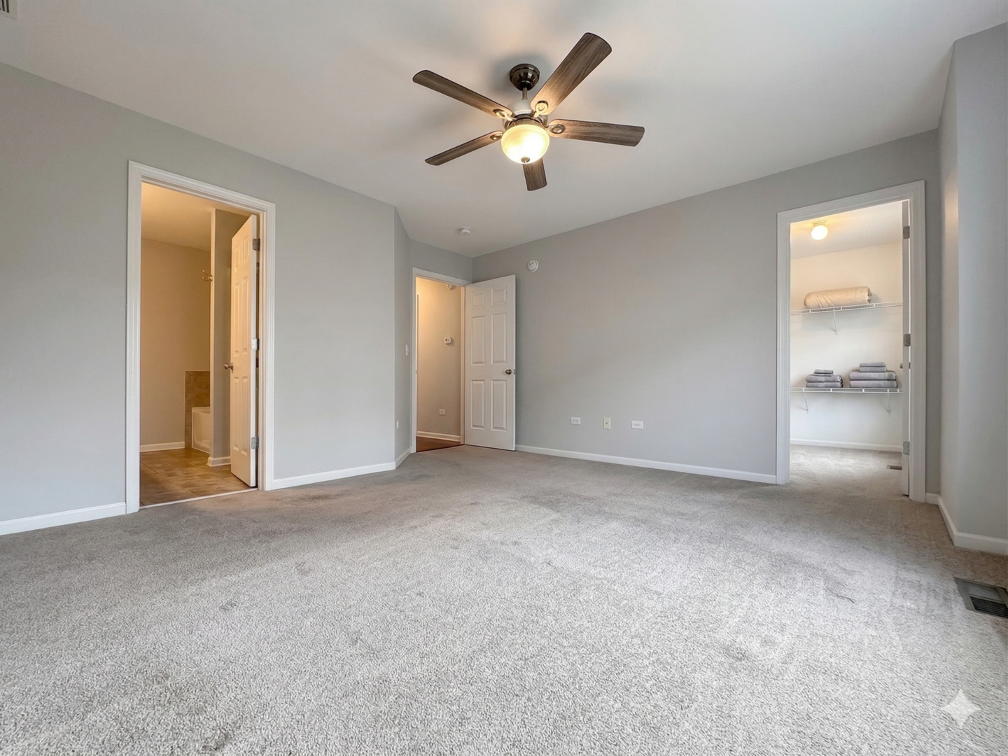 3381 Cameron Drive Elgin, IL 60124 - Photo 14 of 23 a view of an empty room with a ceiling fan