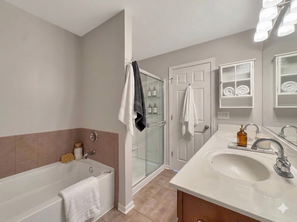 3381 Cameron Drive Elgin, IL 60124 - Photo 16 of 23 a bathroom with a sink and a tub