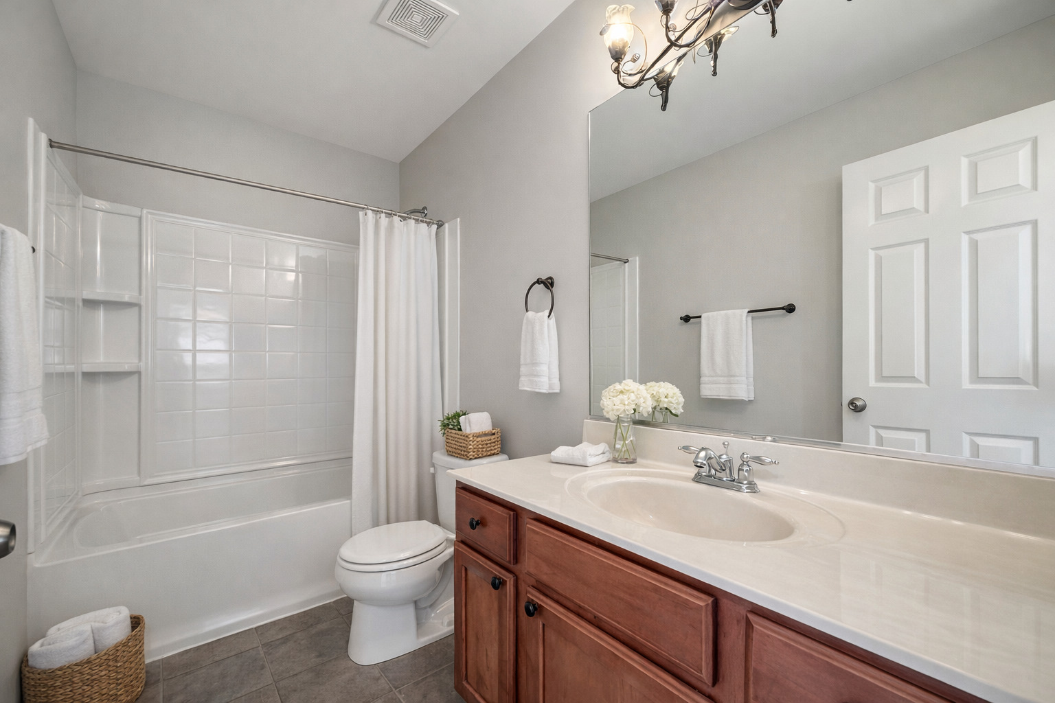 3381 Cameron Drive Elgin, IL 60124 - Photo 18 of 23 a bathroom with a granite countertop sink toilet a shower and a mirror