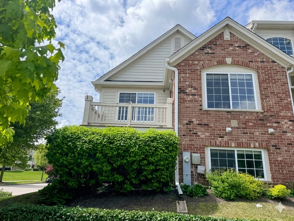 3381 Cameron Drive Elgin, IL 60124 - Photo 2 of 23 a front view of a house with garden