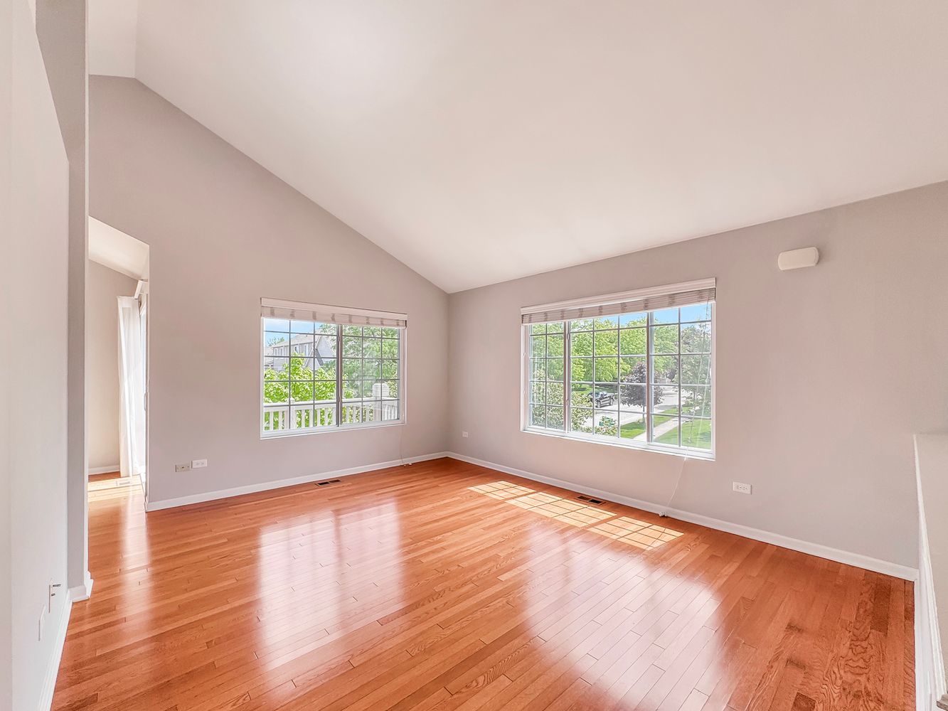 3381 Cameron Drive Elgin, IL 60124 - Photo 5 of 23 an empty room with wooden floor and windows