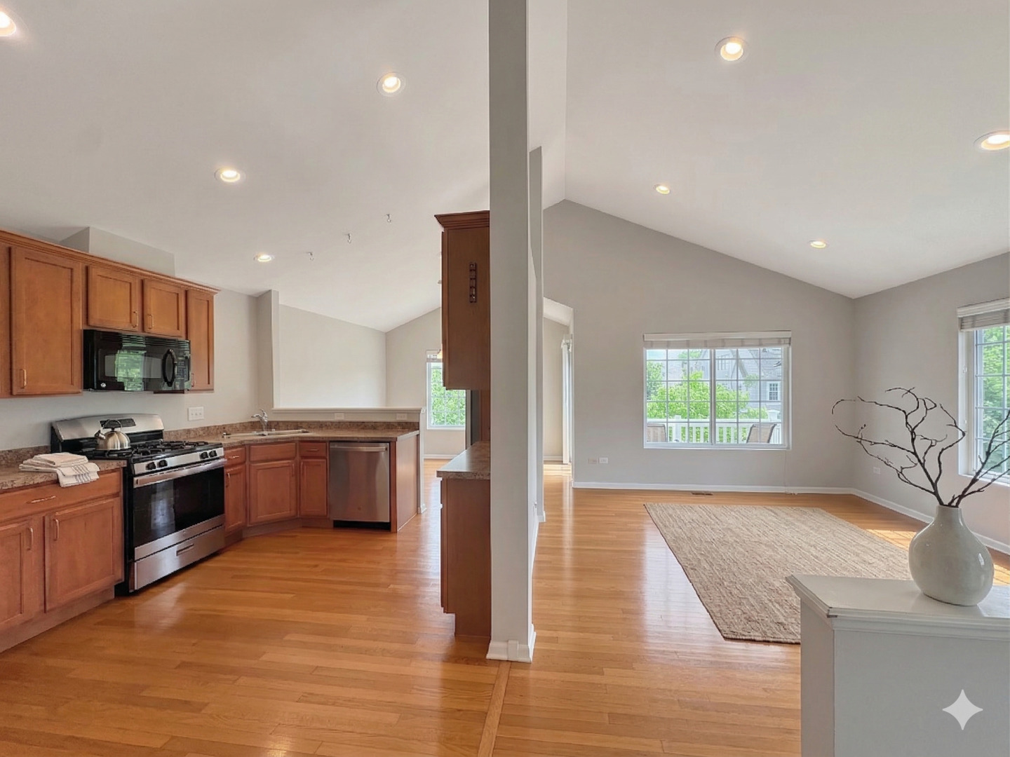 3381 Cameron Drive Elgin, IL 60124 - Photo 7 of 23 a large kitchen with stainless steel appliances granite countertop a sink and a stove