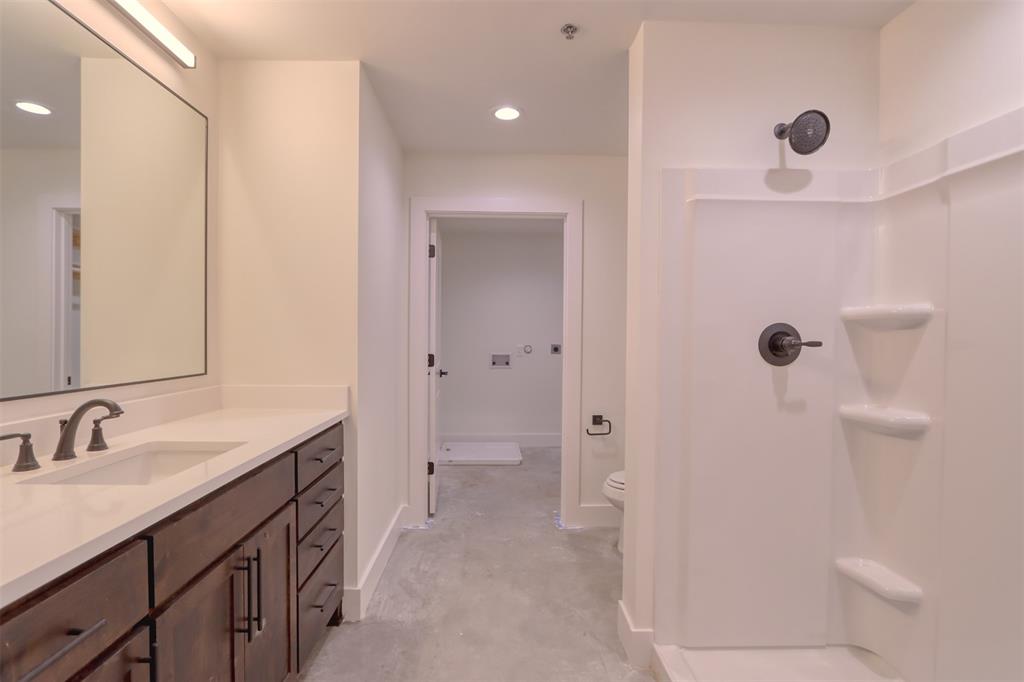 301 West Main Street Midlothian, TX 76065 - Photo 5 of 6 Full bathroom featuring a shower, vanity, recessed lighting, and concrete flooring